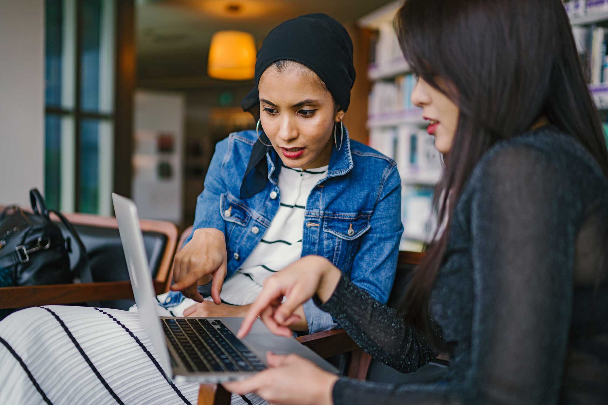 women working together at a computer