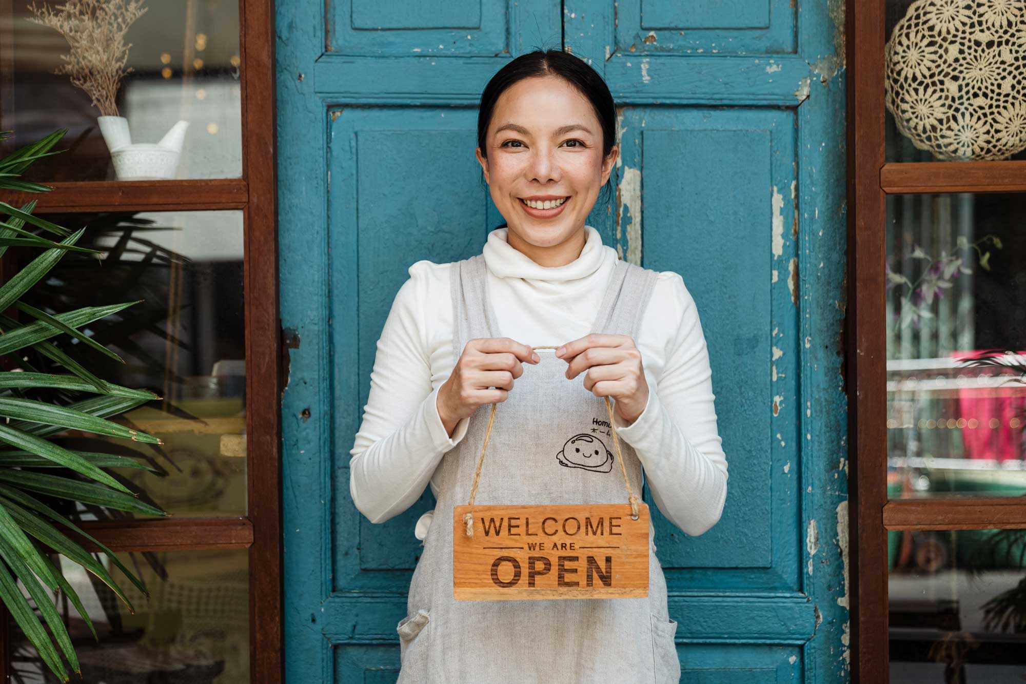 women in front of her store